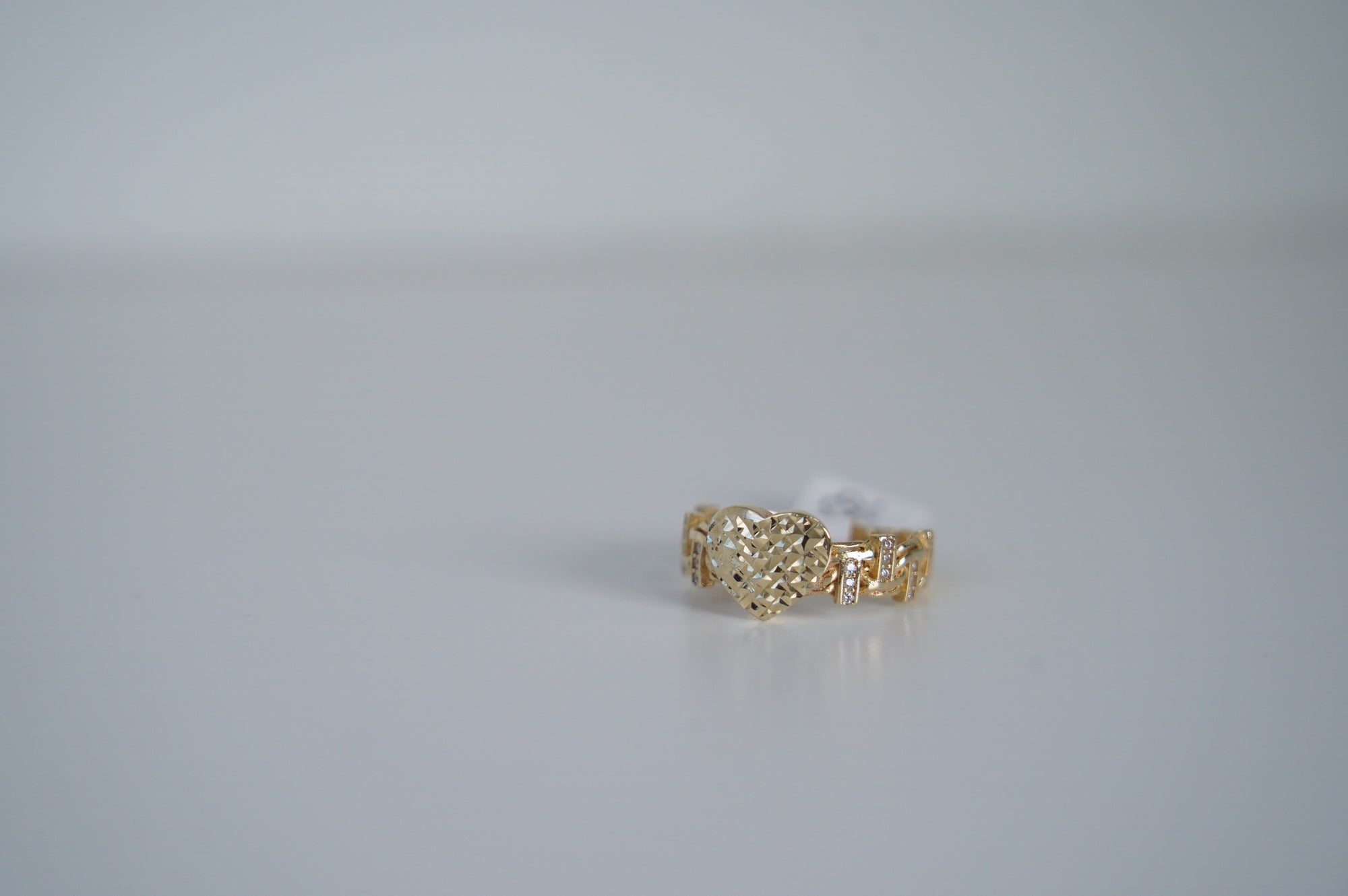 Gold Heart Patterned Ring with Diamonds