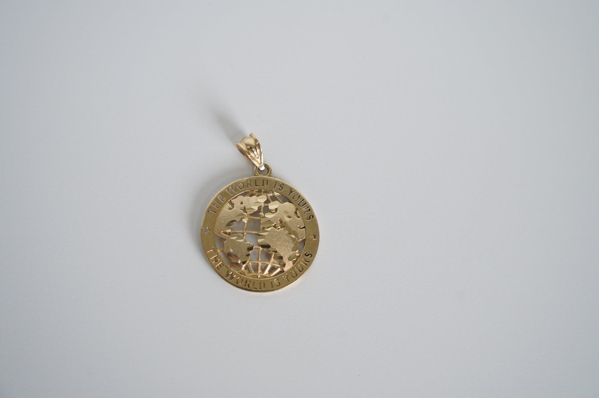 The World Is Yours Gold Pendant